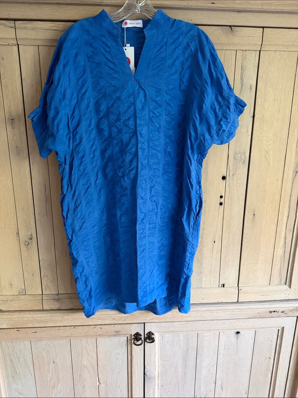 Caryn Lawn royal blue short dress with drop short sleeves.